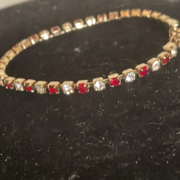 7.5” gold plated tennis bracelet with 38 prong set red and clear crystals - Picture 6 of 15